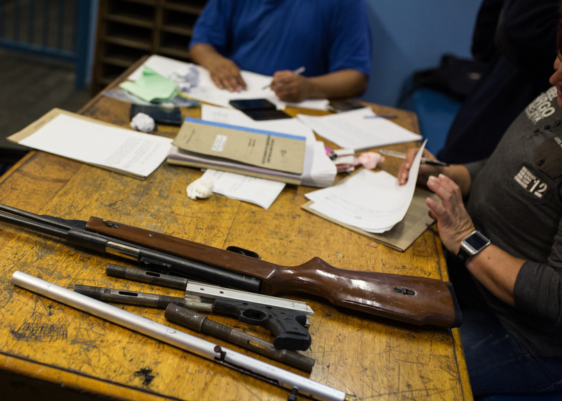 Confiscated home-made firearms are booked into evidence at the Grassy Park police station, Cape Town.
