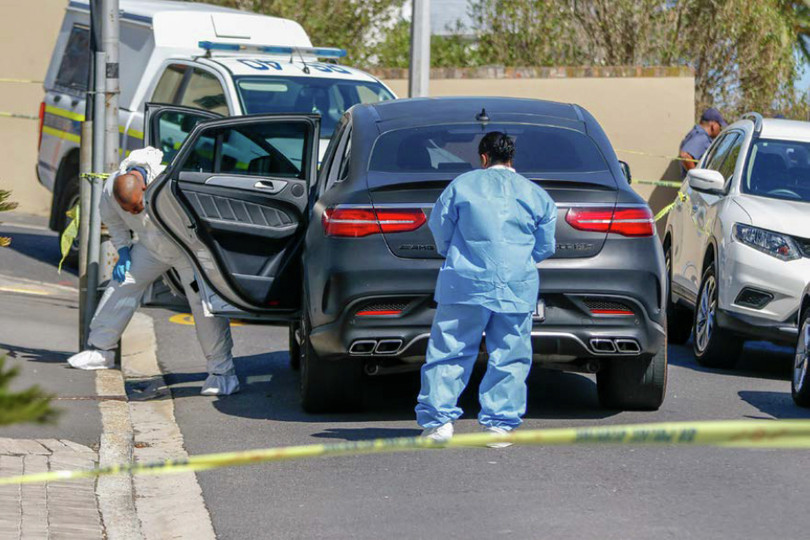 Left: A forensics team examines the car in which Cape Town lawyer Pete Mihalik was shot dead in 2018 outside his son’s school.
  Right: Court proceedings during the Pete Mihalik murder case at the Cape Town Magistrates’ Court on 29 November 2018.
