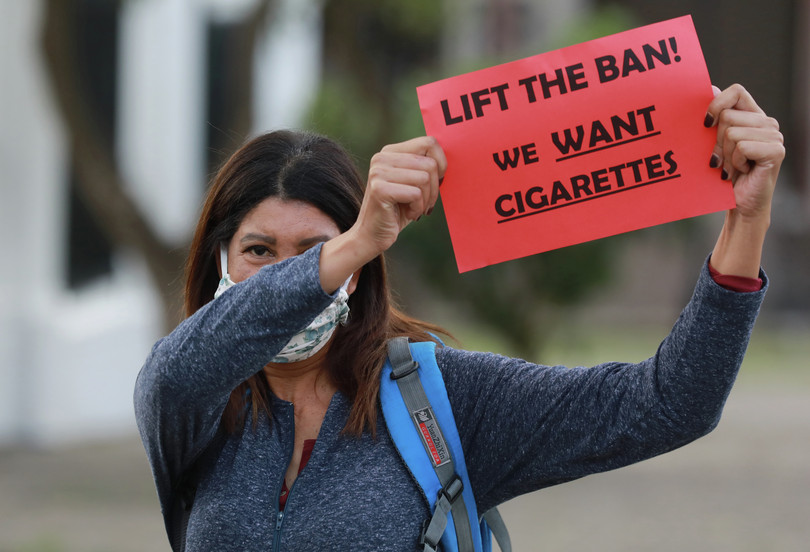 A smoker protesting the tobacco ban outside South Africa’s parliament on 2 June.
