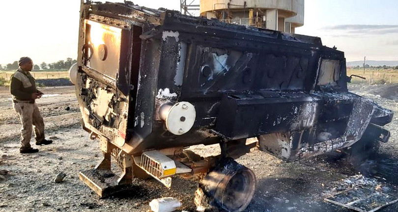 Wreckage of a mining-security armoured personnel carrier that was set alight by attackers at a Sibanye Gold facility.
