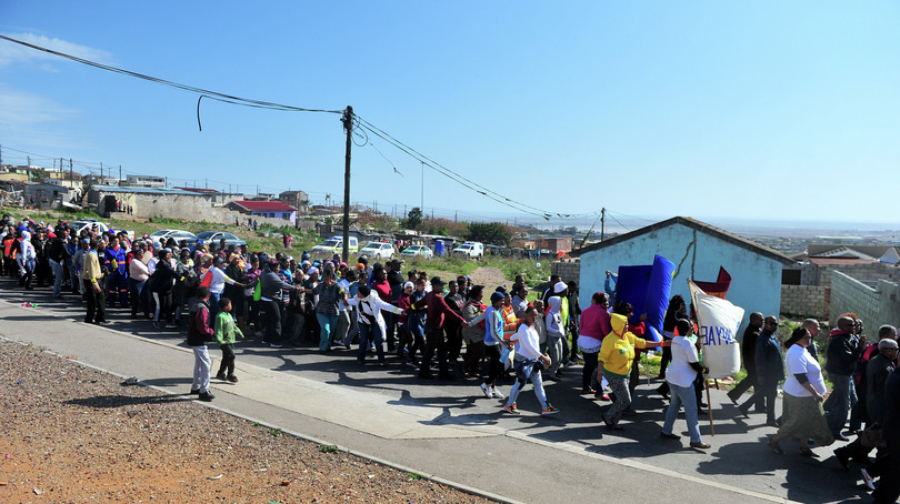 Gelvandale community residents gather during a march against violence and gangsterism in the area, August 2017.
