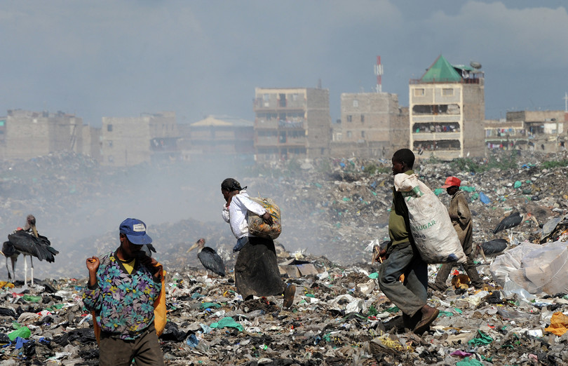 People sort through heaps of garbage at Dandora dumpsite, Nairobi.
