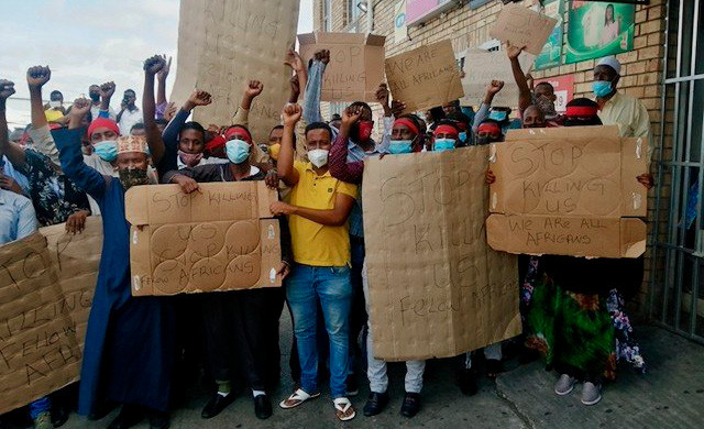 Immigrant ‘spaza’ shop owners protest in Gqeberha against killings of migrant shop owners, extortion and robberies of their stock, February 2021.
