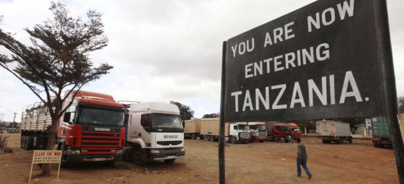 Trucks wait at the Kenya–Tanzania border crossing in Namanga. Cigarettes are smuggled from Tanzania across border points such as Namanga, as higher tax rates on cigarettes in Kenya mean they can be sold on for a profit.
