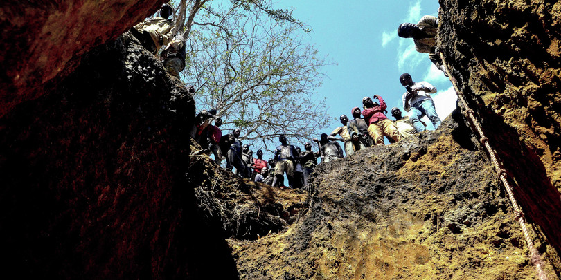 Artisanal miners stand above a site where they search for rubies on the outskirts of the mining town of Montepuez, northern Mozambique.
