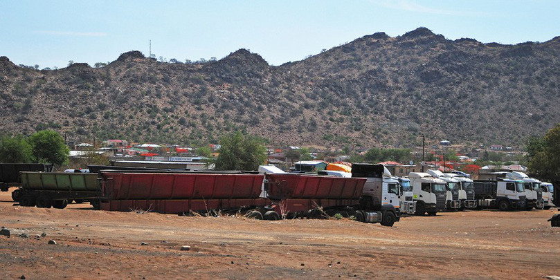 Trucks wait to transport chrome in Atok, Limpopo. Unlicensed artisanal miners mine chrome in the area and sell it to dealers on the black market.
