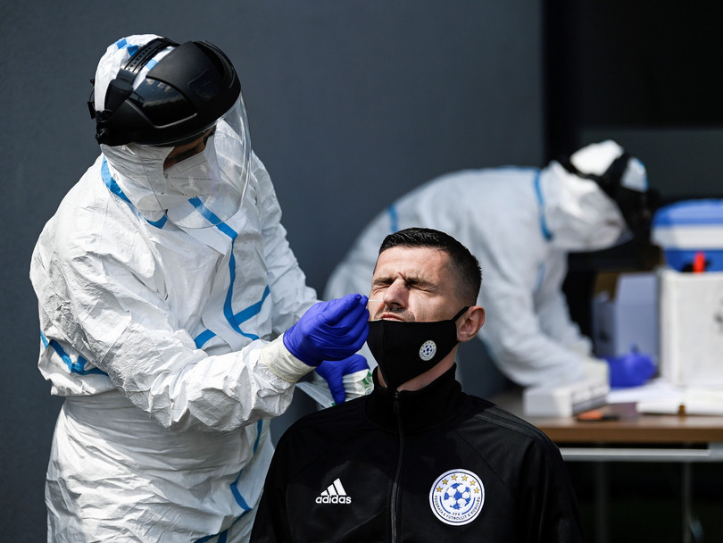 A football referee gets tested for COVID-19 in Pristina, Kosovo.
