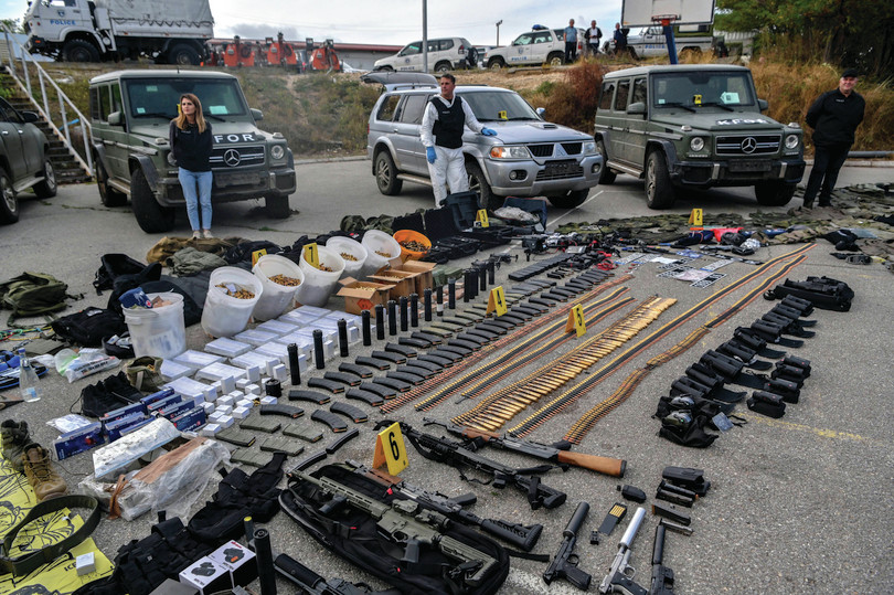 Kosovo police officers display weapons and military equipment seized in the village of Banjska, in Mitrovica in September 2023.
